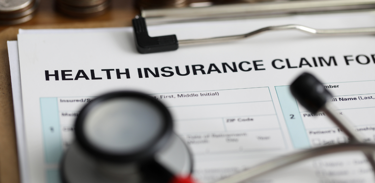 Health insurance claim form on a clipboard with stethoscope, representing medical billing and insurance documentation