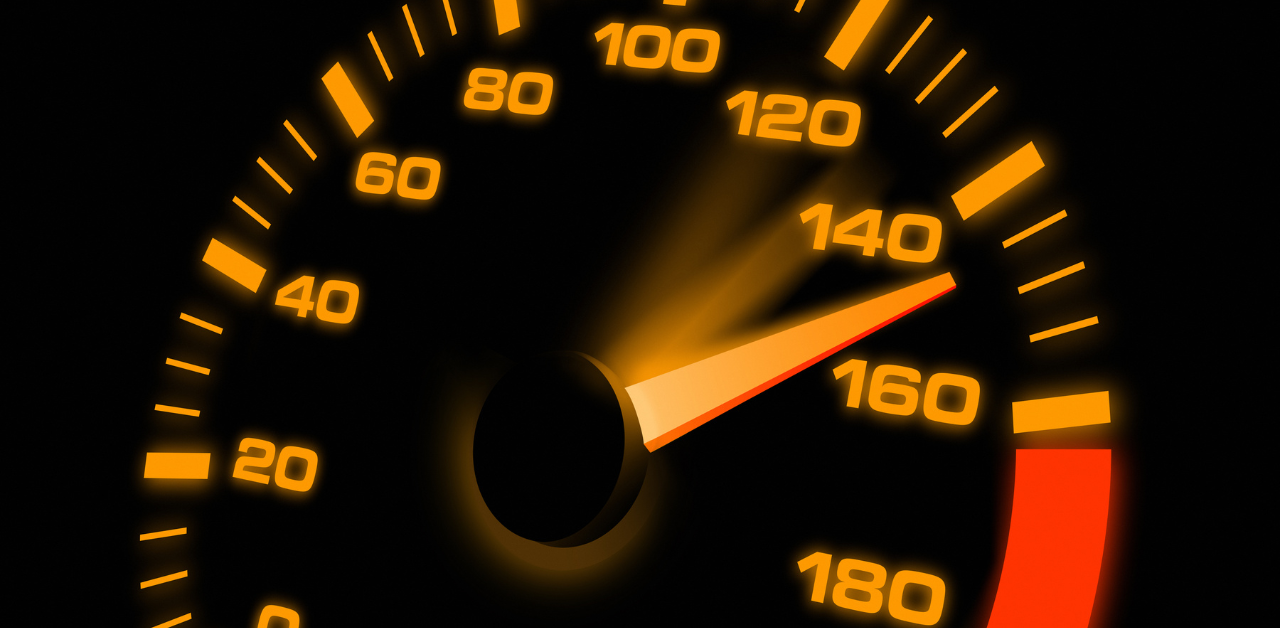 Speedometer glowing orange with needle pointing past 140, indicating extreme speeding or reckless driving