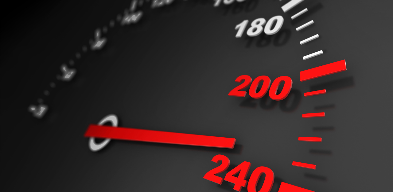 Close-up of speedometer showing high speed, indicating dangerous driving and risk of accident